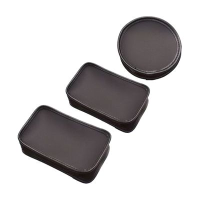 A dark brown leather case for a hand magnifier, shown alongside two similar rectangular cases with stitched edges.