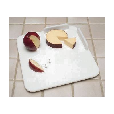 Rectangular white cutting board with rows of metal spikes in the center and a raised plastic food guard along two edges