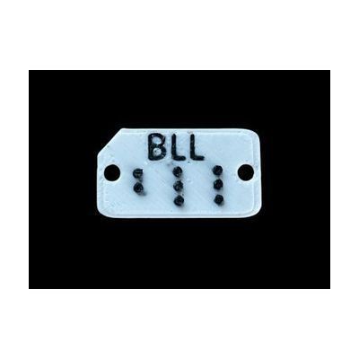 Image: plastic clothing color tags in braille, dark blue