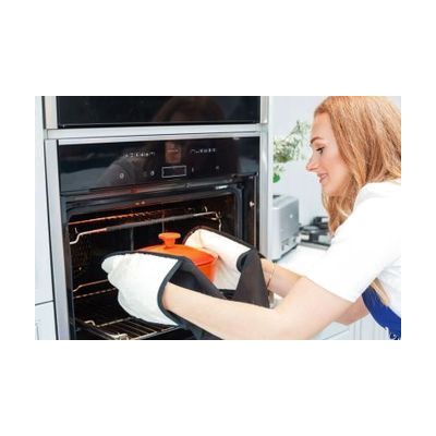 Image: silicone oven rack guard with pot coming out of the oven