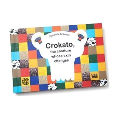 The cover of LDQR's Crokato, the Creature Whose Skin Changes by Claudette Kraemer. The cover has a checkerboard pattern and features the APH and UEB logos.