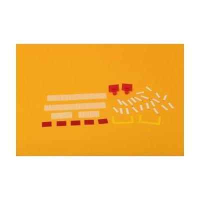 Two long and two short white nets, five red flags, two basketball hoops, two yellow goal posts, and several white hook strips laid out on a yellow background.