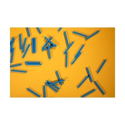 Many small blue rods spread out on a yellow background.