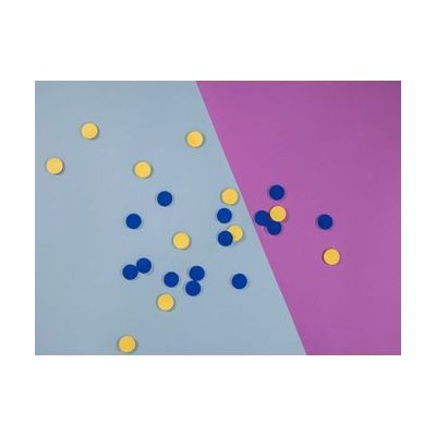 blue and yellow tactile tokens spread on table