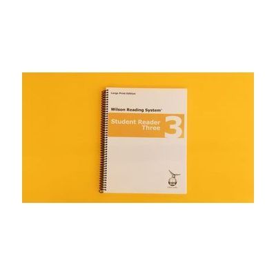 Volumes 1 and 2 of the braille student reader 1 with a red stripe across both covers.