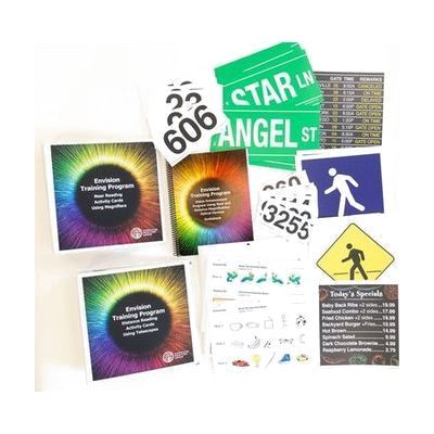 Envision Kit without Optical Aids opened to show training curriculum, activity cards, signage, restaurant menu, and additional large print resources.