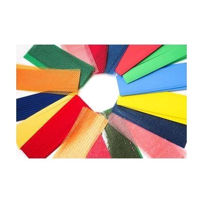 Close up of an assortment of texture strips arrayed in a circle. The strips include flocked styrene, craft foam, and both rough and bumpy textures in a variety of colors.