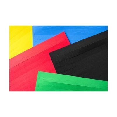 Close up of overlapping perforated border strip sheets in a variety of colors.