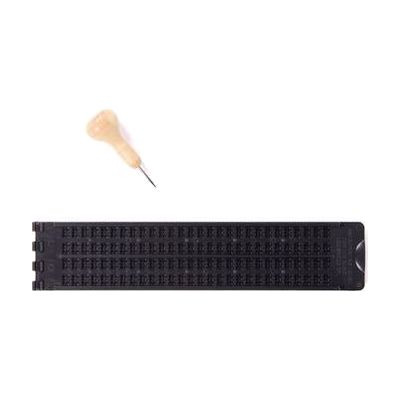 Closed top view of Pocket Braille slate with wooden-handled stylus