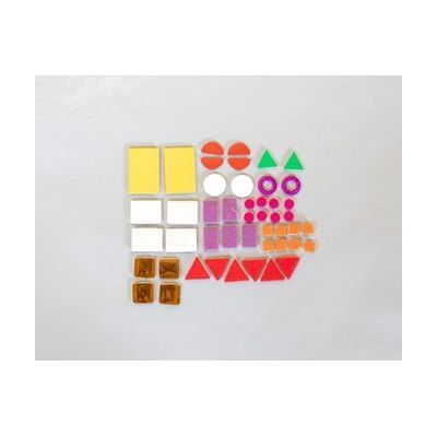 A variety of Picture Maker textured shapes laid out on a gray background including rectangles, squares, triangles, and circles in different sizes and colors.