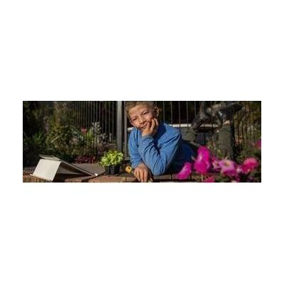 Boy in garden contemplating