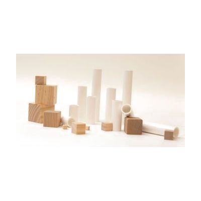 An assortment of white plastic cylinders and wooden cubes in varying sizes
