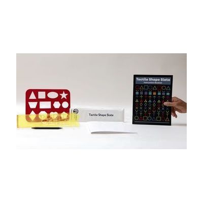 All the components of the Tactile Shape Slate kit, including a yellow slate, a large red stencil, and the guidebook, all laid out on a white background.