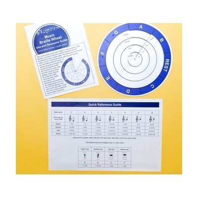 Overhead view of the complete Music Braille Wheel Kit, including the physical wheel, Use and Resource Guide, and the Quick Reference Guide.