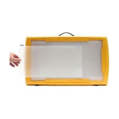 a hand setting the Dycem on the Light Box