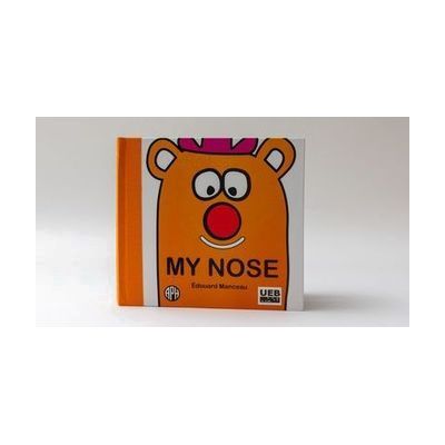 My Nose front cover on a white background. The main character is orange with a pink hat and a red nose. The book says "My Nose" with an APH logo in the bottom left corner and a UEB logo in the bottom right.