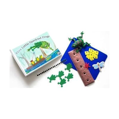 The Five Little Speckled Frogs binder and tactile components laid out on a white background. The kit includes a storyboard, tactile frogs and dragonflies, a log, and combination large print and braille number cards. On the cover of the binder is an illustration of one speckled frog leaping off the hollow log into a pond of blue water. Three frogs remain on the log, and one is catching a dragonfly with its tongue.