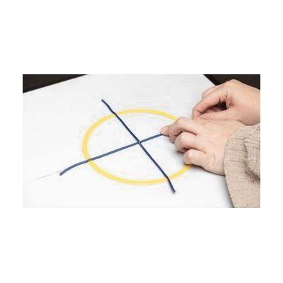 A hand exploring a tactile yellow circle placed on an AnyMath board with blue line strips dividing the circle into fourths.