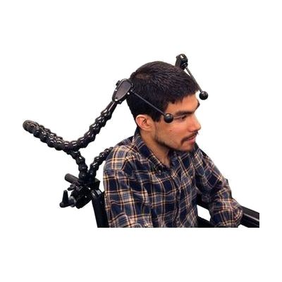 A man sitting in a wheelchair with an adjustable flex dual ultimate switch.