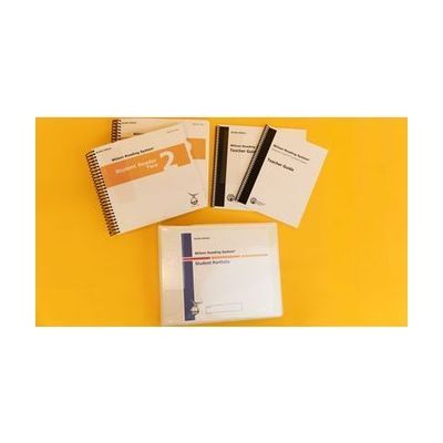 Wilson Reading System IV braille step two on a yellow background, including two volumes of the student reader 2, braille and large print versions of the teacher guide, and the braille student portfolio.
