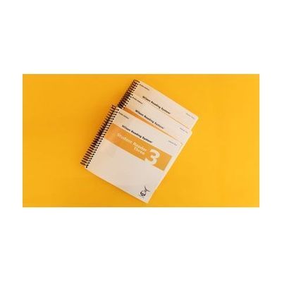 Volumes 1, 2, and 3 of the braille student reader 3 with a yellow stripe across all three covers.