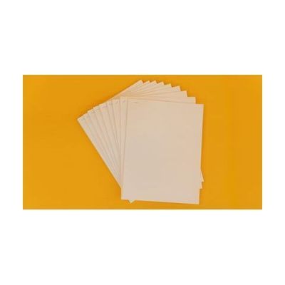A stack of braille sheets stapled into several groups. The sheets have been fanned out and placed on a yellow background.
