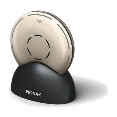 Small circular gold-colored wireless microphone, roughly 2 inches in diameter, with a smooth top surface and subtle button co