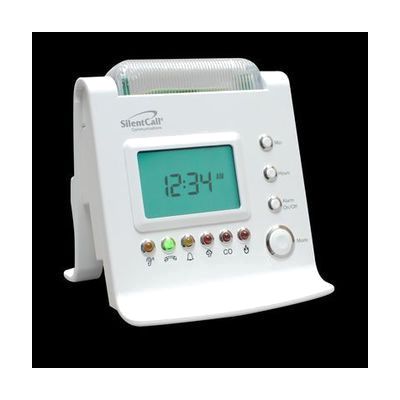 White rectangular bedside receiver unit with digital clock display and a row of colored indicator lights and icons, approxima