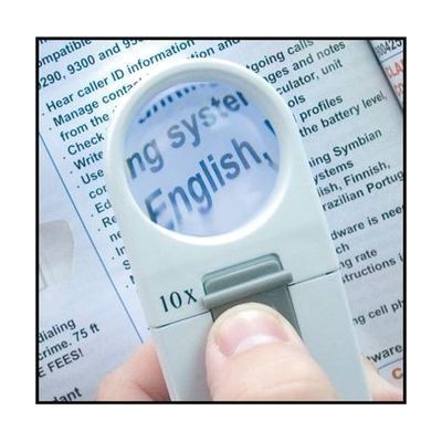 Small handheld magnifier under 6 inches long with a round 35mm lens and integrated LED light, silver and black body