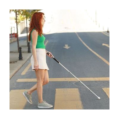 Tall folding white cane with black electronic handle unit at top, featuring tactile control buttons, approximately 59 inches 
