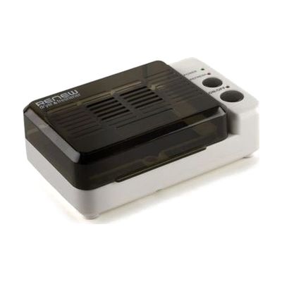 Small white oval-shaped hearing aid dryer with a hinged lid, compact enough to fit in a palm