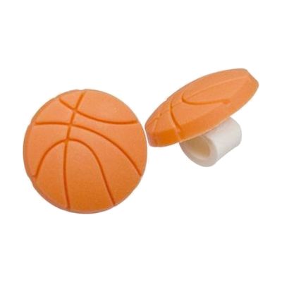 Small orange and black rubber basketball-shaped charm designed to slide onto hearing aid tubing