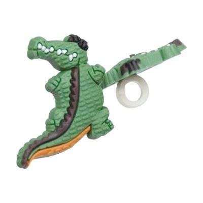 Small colorful rubber clip shaped like an alligator, designed to slide onto hearing aid tubing