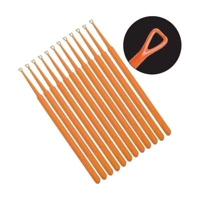 Orange plastic ear curette with a small bent loop tip, resembling a thin wand about 5 inches long