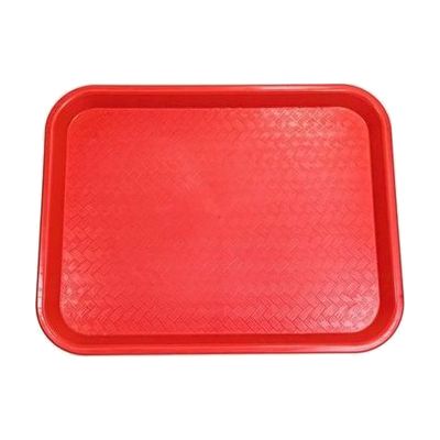 Small rectangular red plastic tray with raised edges and basket-weave textured surface, approximately 10 by 14 inches