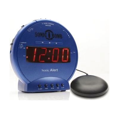 Round cylindrical alarm clock in stealth gray with red control buttons, red LED display, and a separate circular bed shaker d