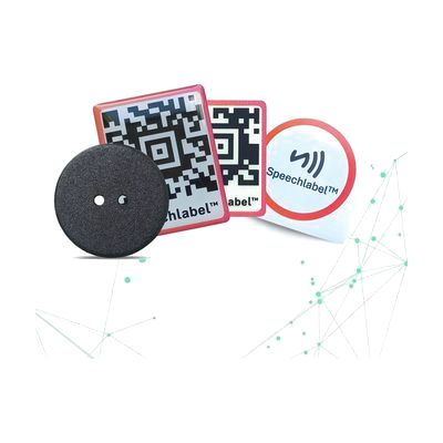 Small assortment of white adhesive label stickers and round NFC button tags in various sizes on a white background