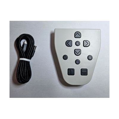 A white triangular keypad with black directional and control buttons, shown beside a black cable.