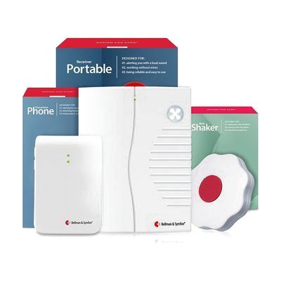 An alerting system kit with a white portable receiver, a white phone signal unit, a round bed shaker, and their retail boxes.