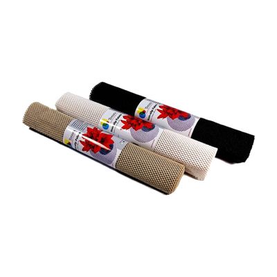 Three rolls of non-slip mesh fabric in tan, white, and black, each wrapped with a round paper label.